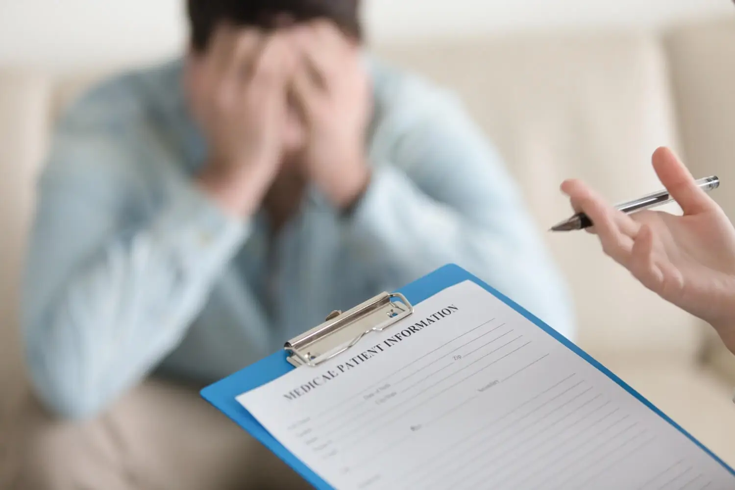 New patient completing intake forms at Ear to Ear Behavioral Health Chicago